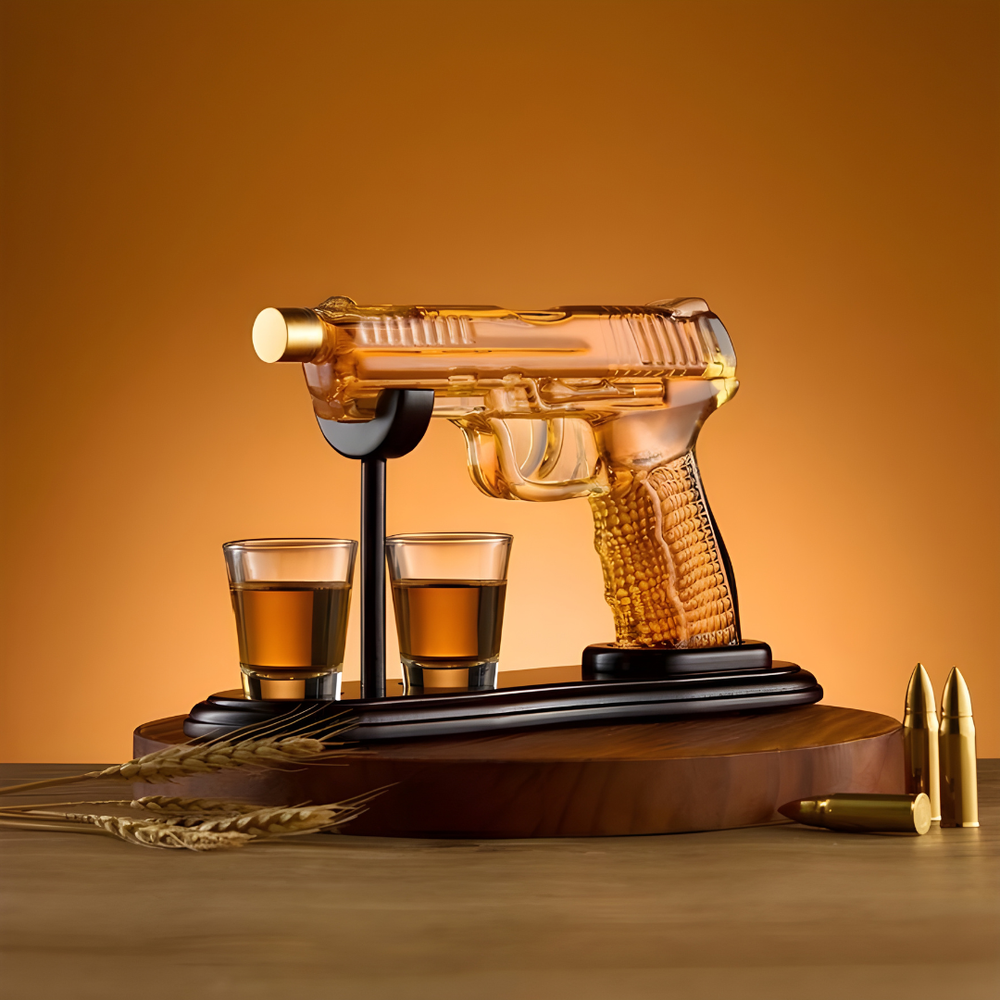 Pistol Whiskey Decanter Set displayed with crystal glasses and bullets on a wooden base, highlighting its unique design.