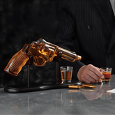 Pistol Whiskey Decanter Set showcasing a crystal decanter and glasses, perfect for bold whiskey pours.