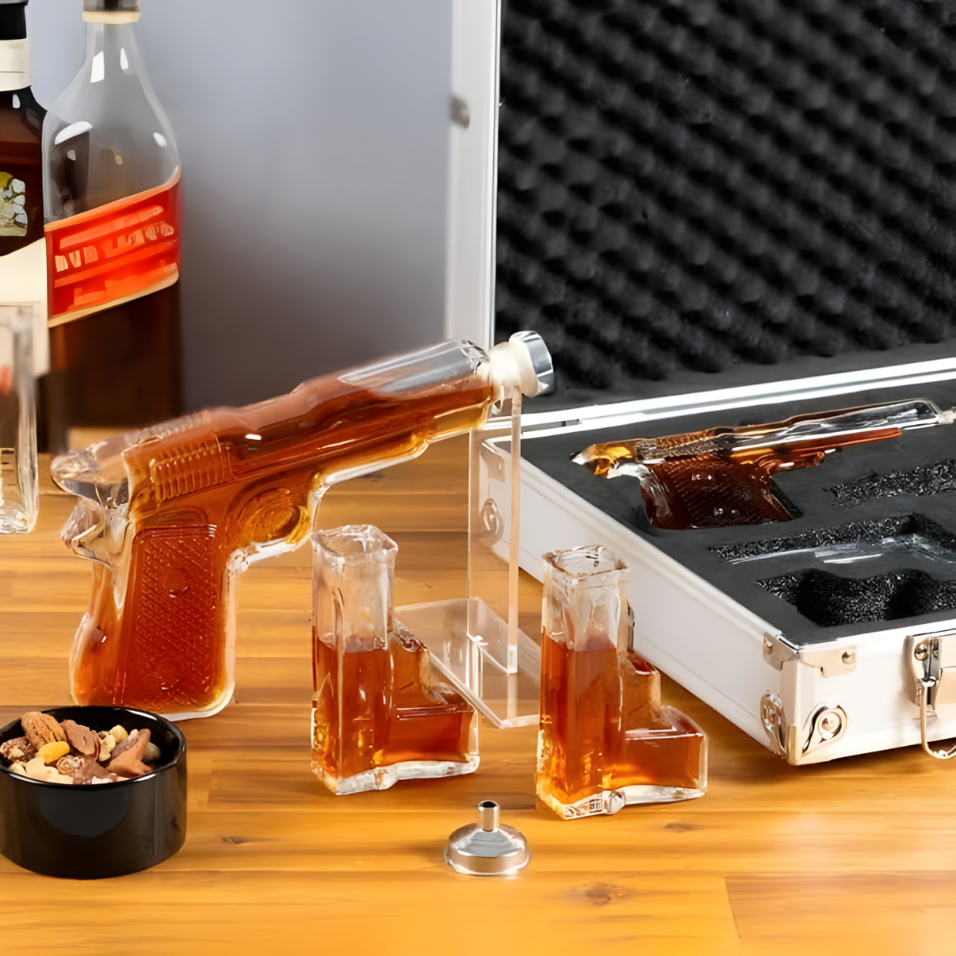 Pistol Whiskey Decanter Set displaying a pistol-shaped decanter and crystal glasses in a sleek premium gift box.