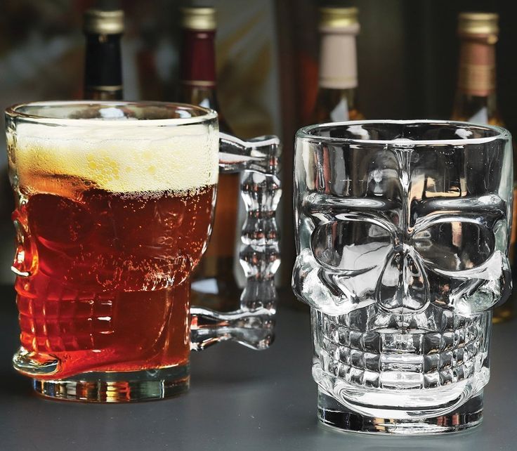 Set of 4 Halloween Skull Glass Beer Mugs for spooky celebrations.