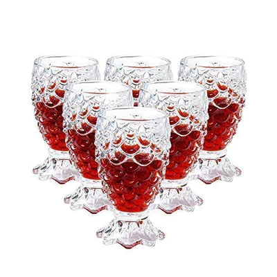 Set of six textured crystal whiskey glasses filled with amber liquid, elegant barware
