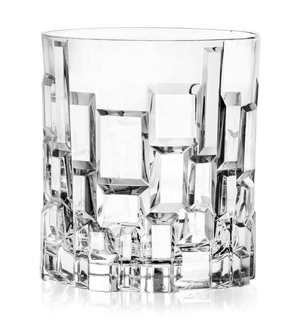 Clear crystal whiskey glass with geometric, textured pattern on a white background
