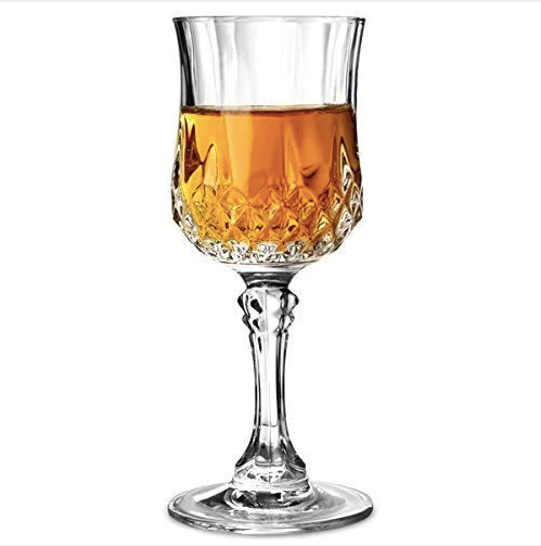 Crystal wine goblet with amber liquid, elegant cut design, perfect for home barware