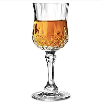 Crystal wine goblet with amber liquid, elegant cut design, perfect for home barware